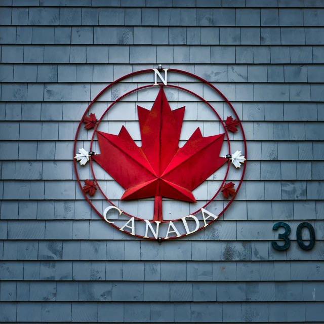 a sign on the side of a building that says n canada