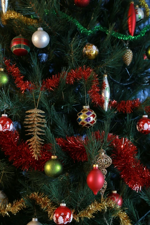 a christmas tree decorated with red and green ornaments