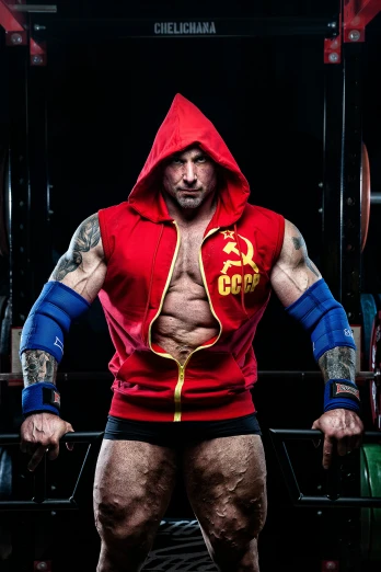 a man with a hoodie and muscles showing