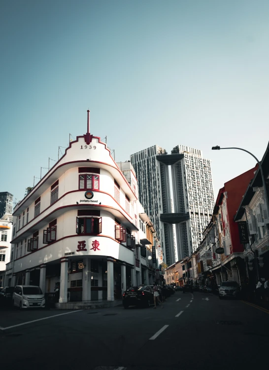 the building is painted white and red with chinese writing on it