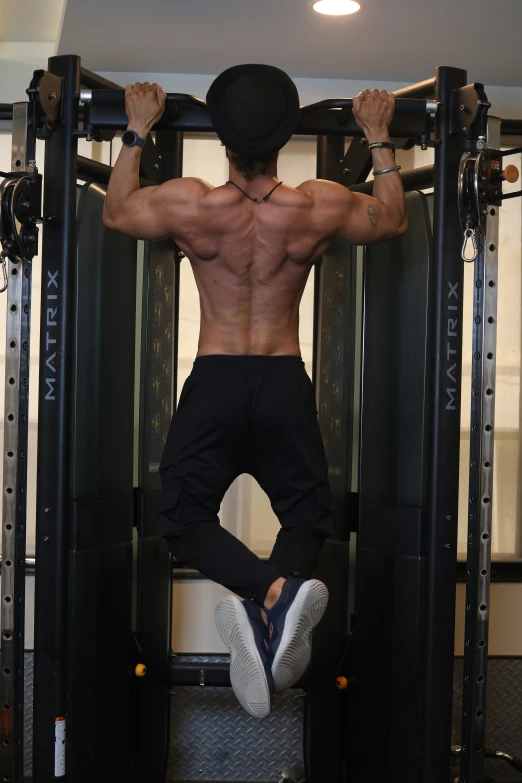 a man is performing exercises on a weight machine
