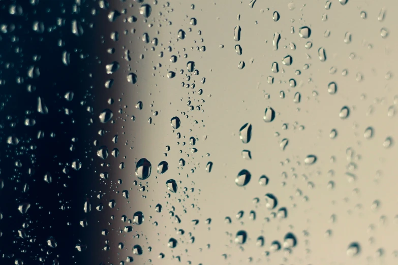 rain drops on the window outside during a day