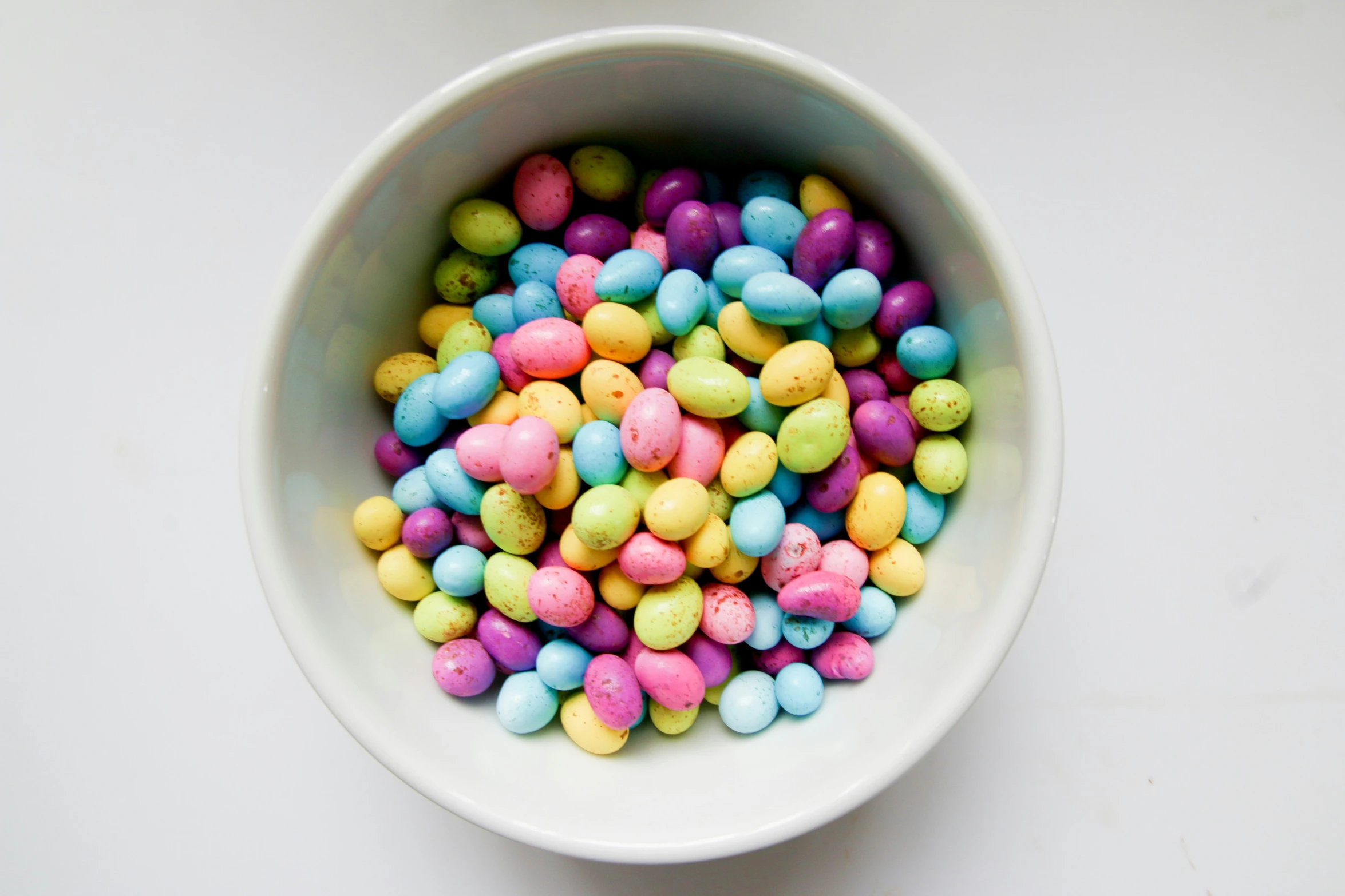 a close up of a bowl of candy