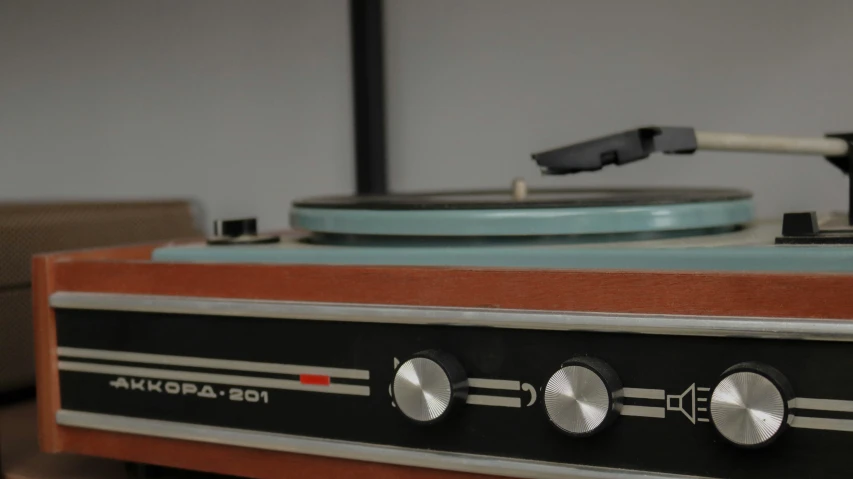 this machine is holding two different types of turntables