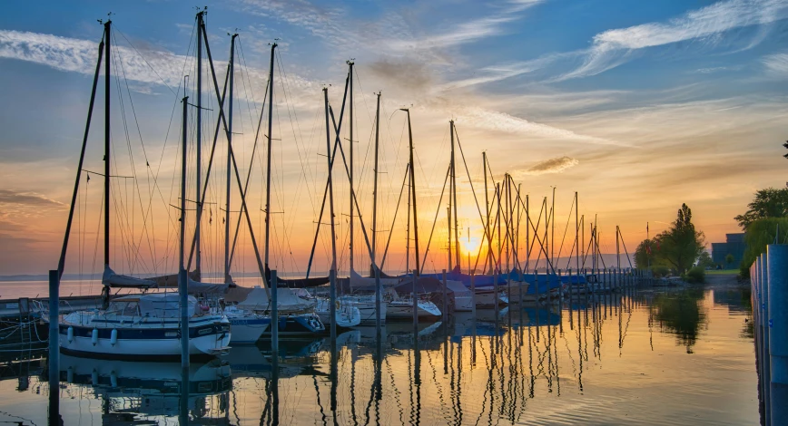 a couple of boats sit next to each other in the water