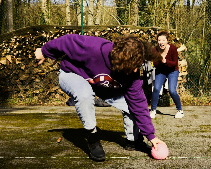 a group of people playing with a frisbee