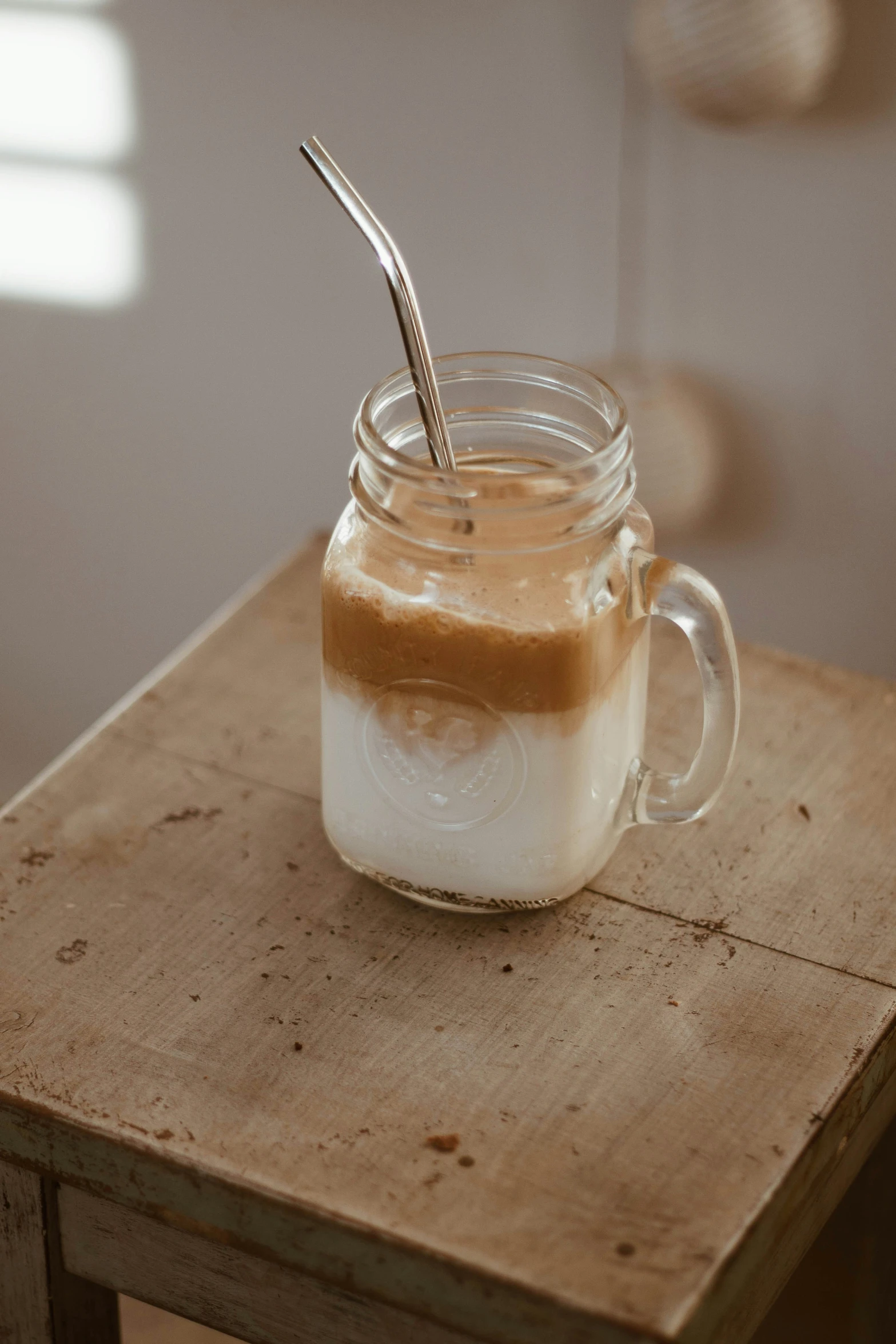 this glass has ice cream in it and a spoon