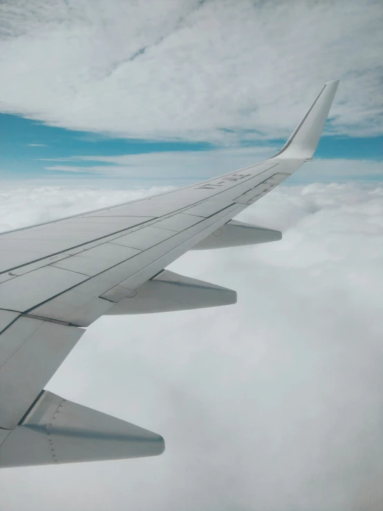the view from inside an airplane showing the wing