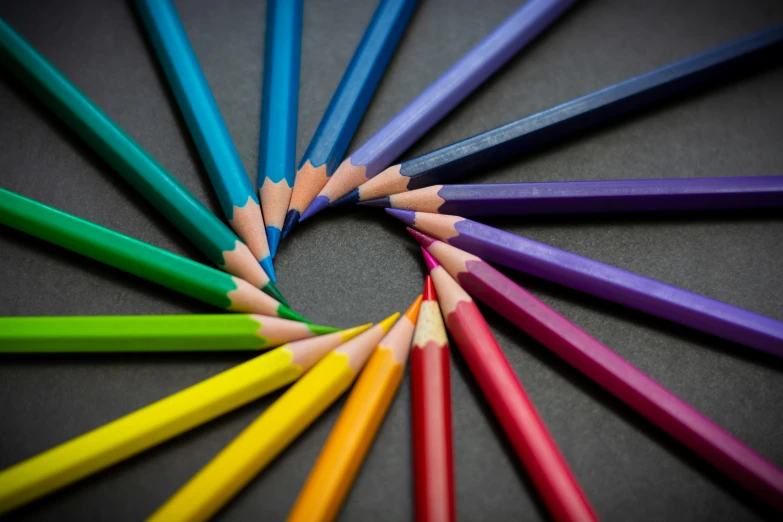 a circle of colored pencils in a circle