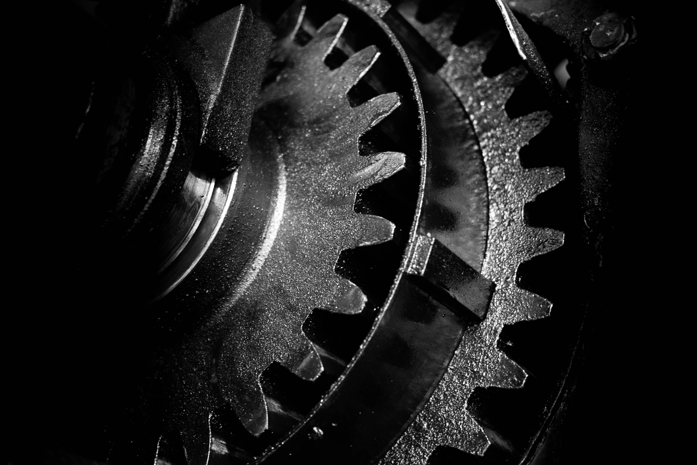 a close up s of gears in black and white