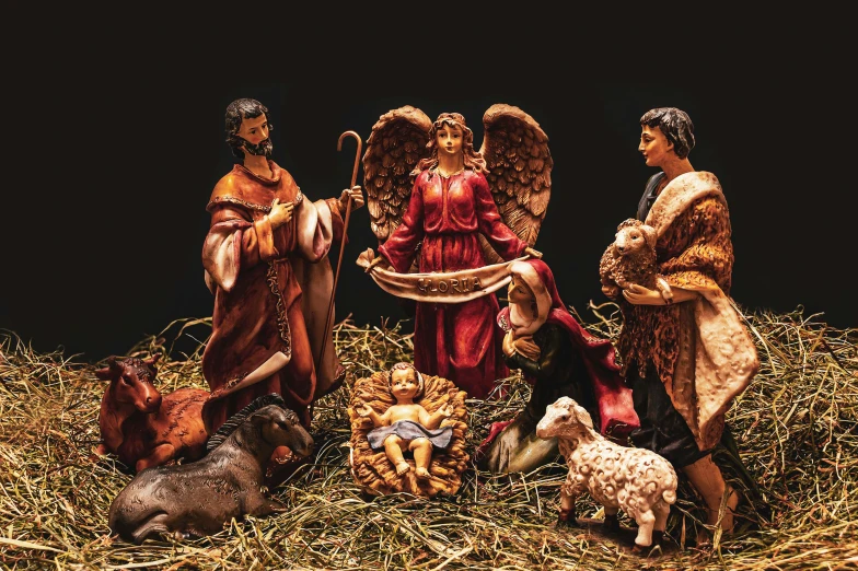 an nativity scene is featured with figurines