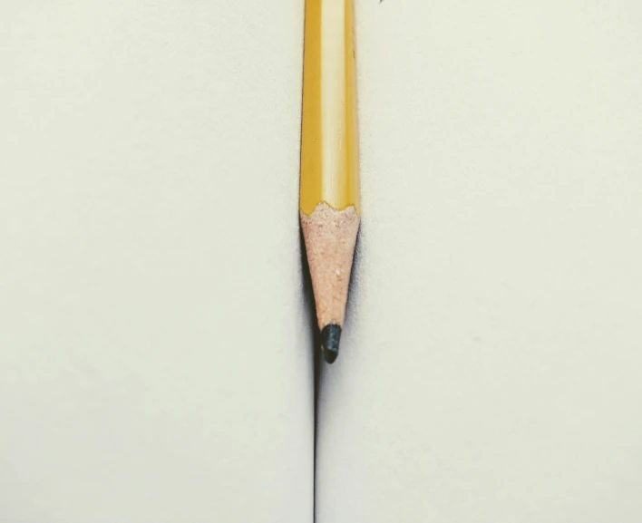 a pencil that is attached to another pencil