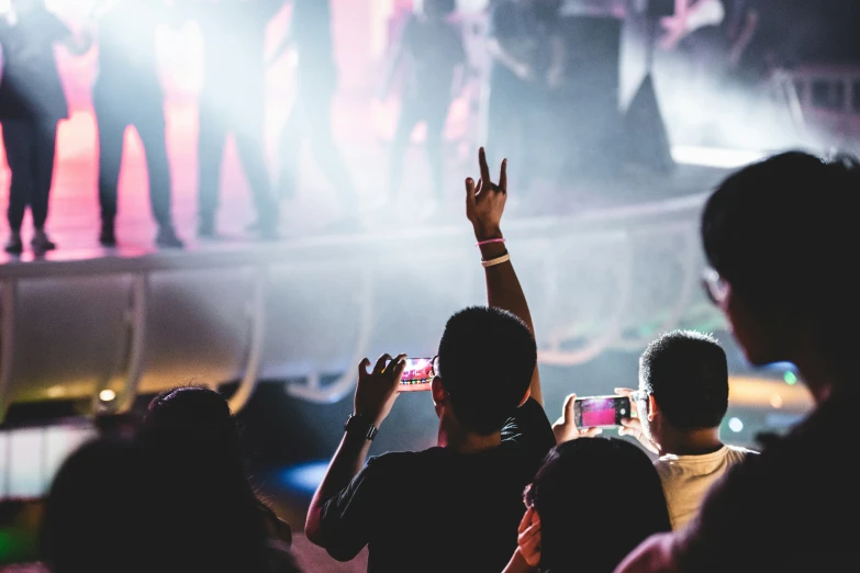 people at an event are watching a person perform