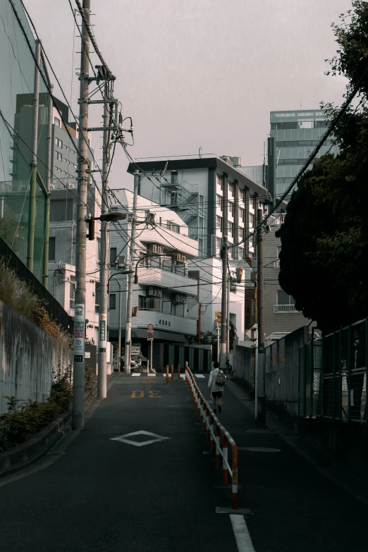 the city street has some empty streets and tall buildings