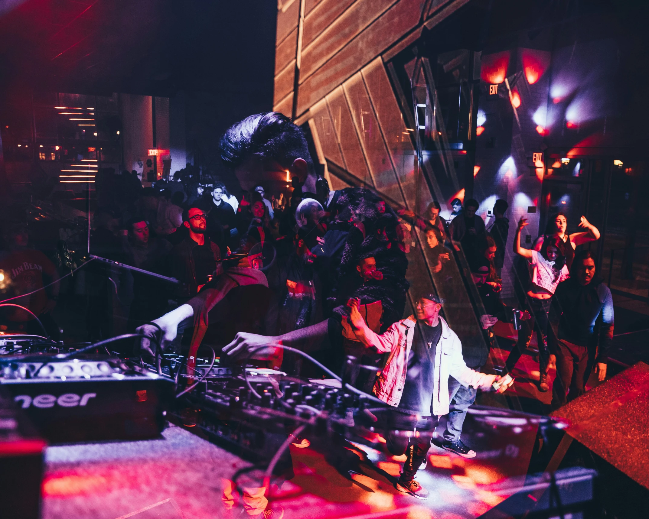 a dj spins on top of a turntable during a party