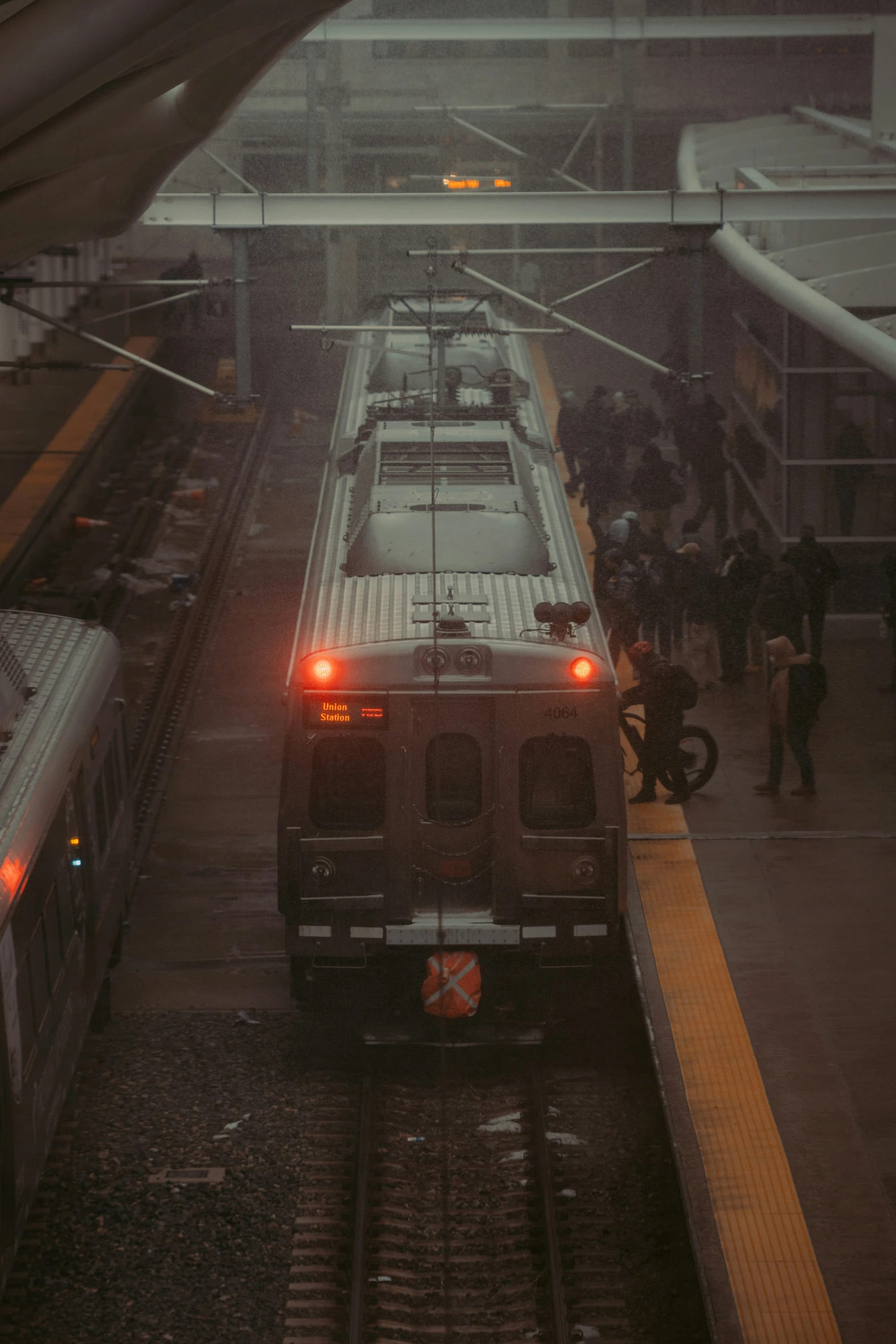 two trains parked side by side at a train station