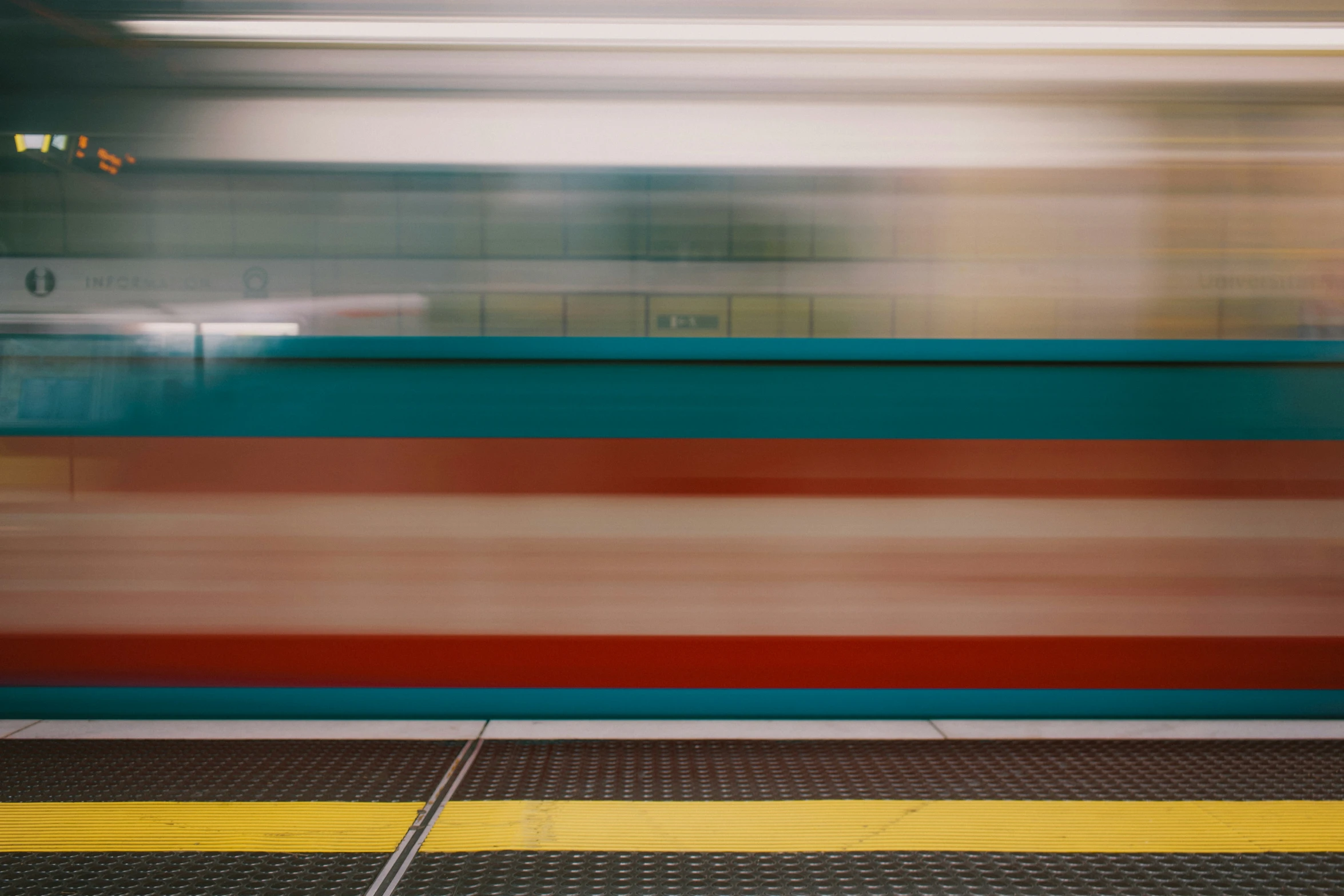 blurred image of a train and its tracks in motion