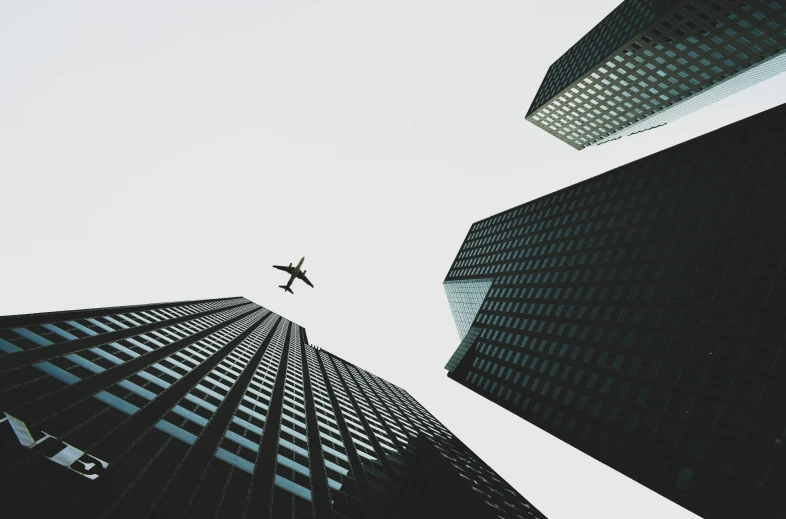 a po taken from ground level looking up at a airplane in the sky