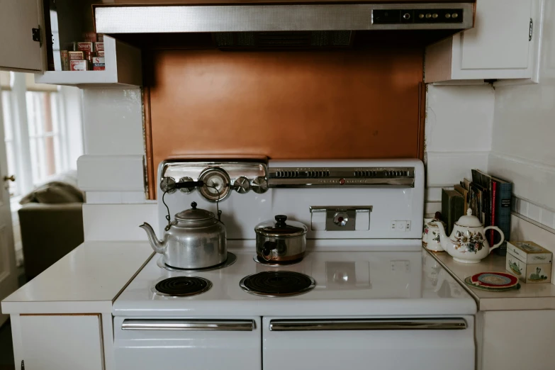 there is an old stove with some items on it