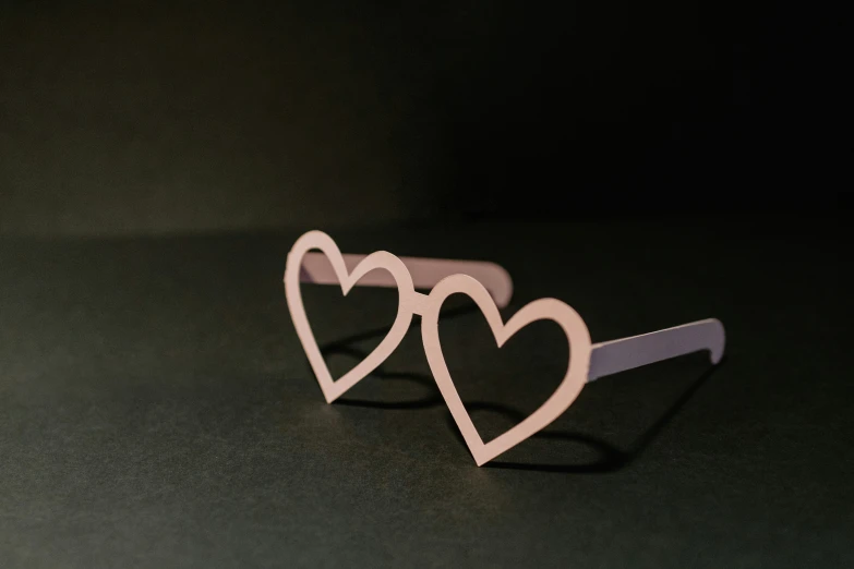 a pair of sunglasses made to look like two hearts