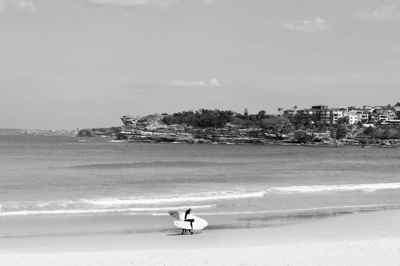 a person with a surfboard in a body of water