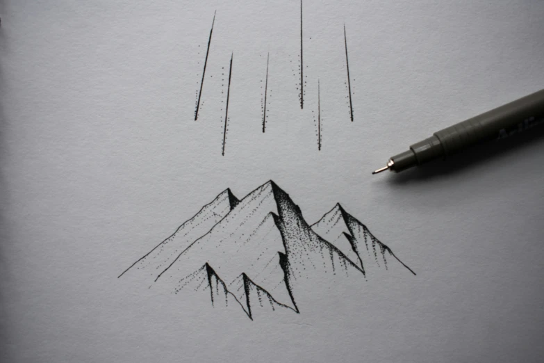 a drawing of two mountains that are on top of the paper