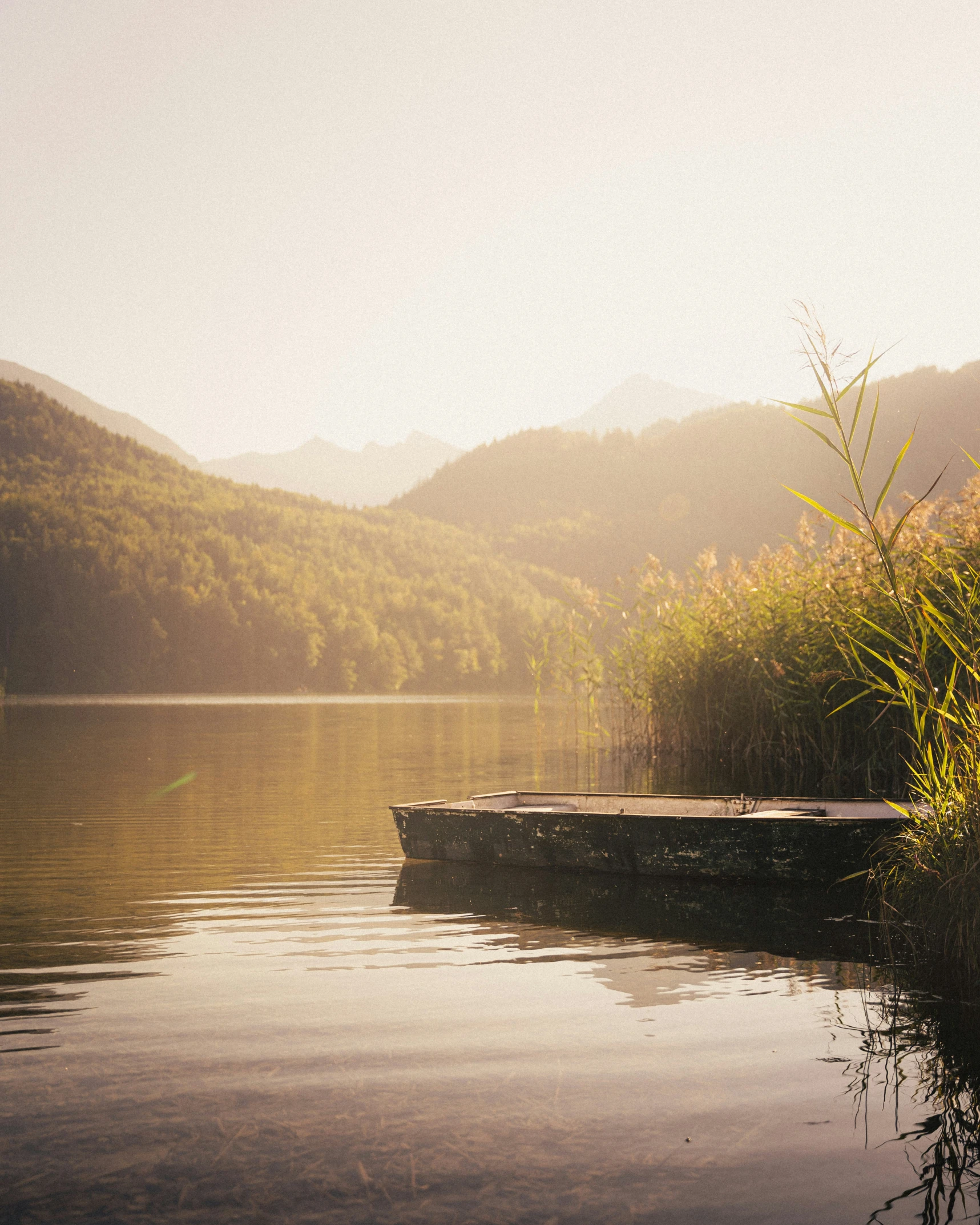 a small boat in the middle of a lake