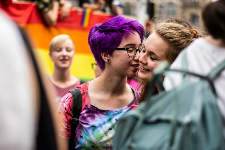 three s standing next to each other on a street