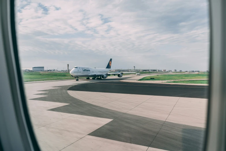 an airplane with propellers sitting on the runway