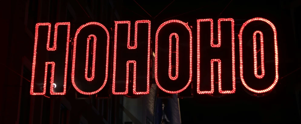 a large sign is lit up in the dark