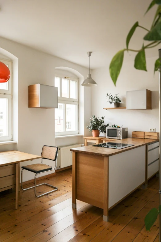 a clean and modern style home kitchen in an apartment