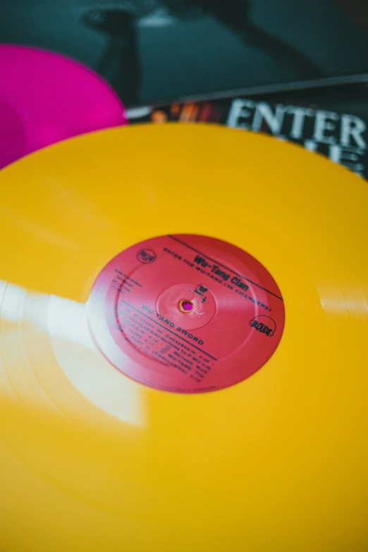 an open yellow record with red and white labels