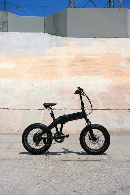 a bike sitting against the side of a wall