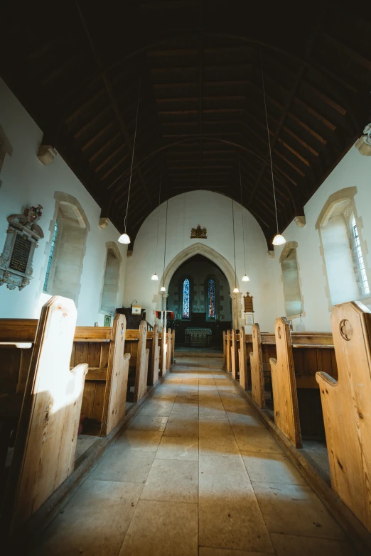 the interior of a church with lights on