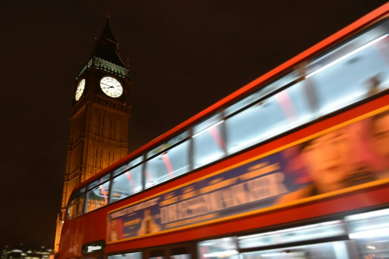 the large building has a clock on the front of it