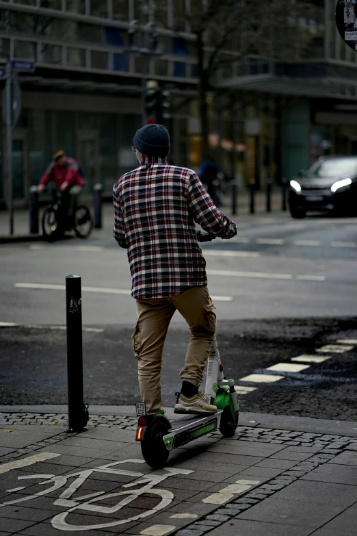 a man riding a scooter on the road