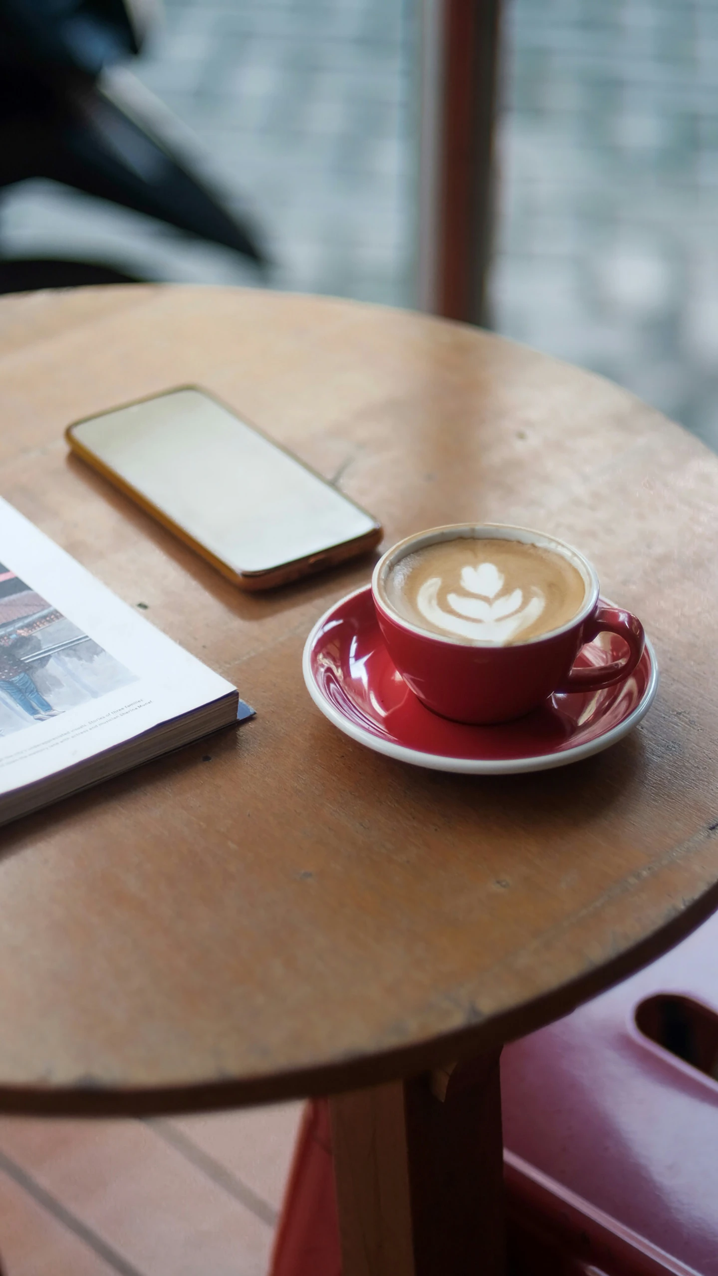 a cappuccino with a drink sitting on the table