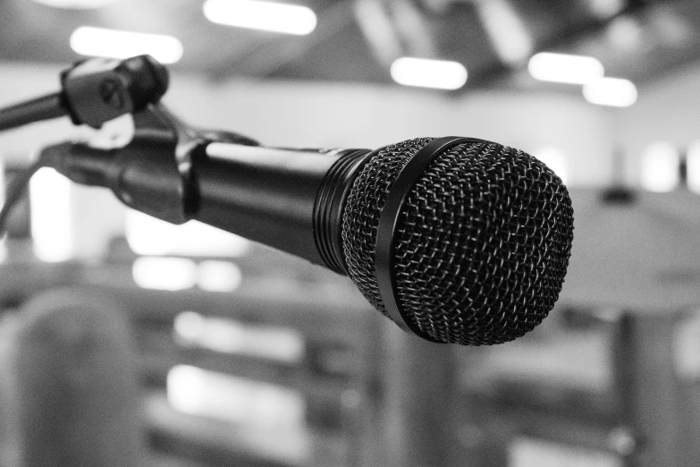 a microphone in front of a wall and lights