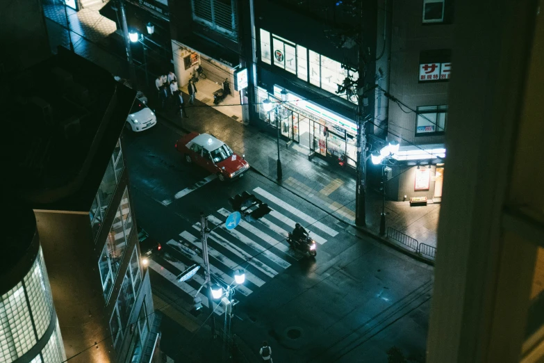 a busy city intersection at night with traffic lights