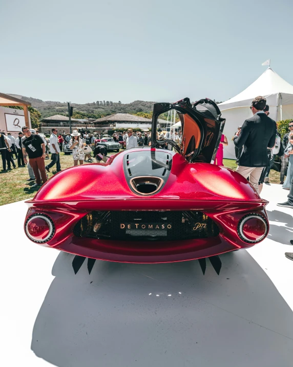 a red and black car on display at a car show