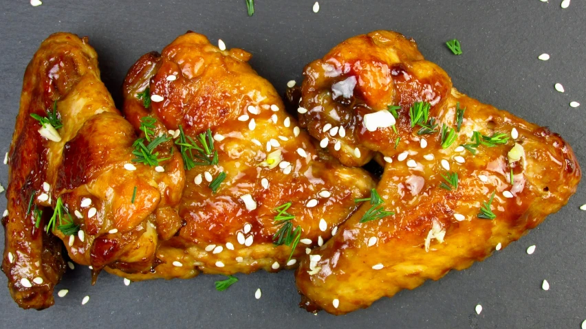 two fried chicken pieces on a plate