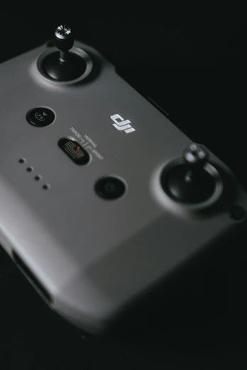 a black and white pograph of a camera video game controller