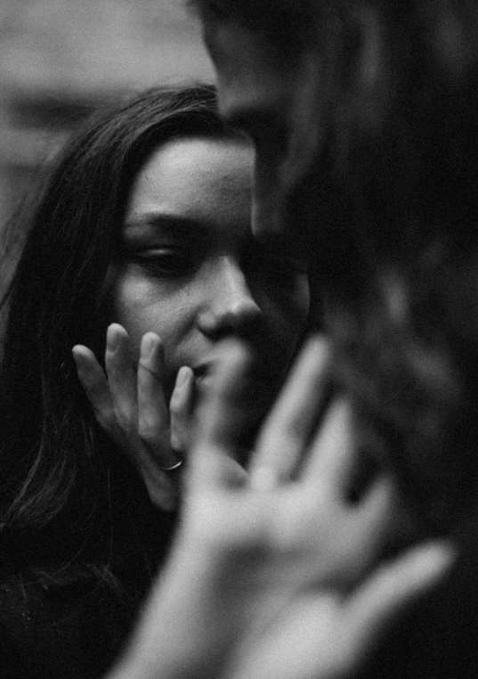 black and white po of a woman talking on a cell phone