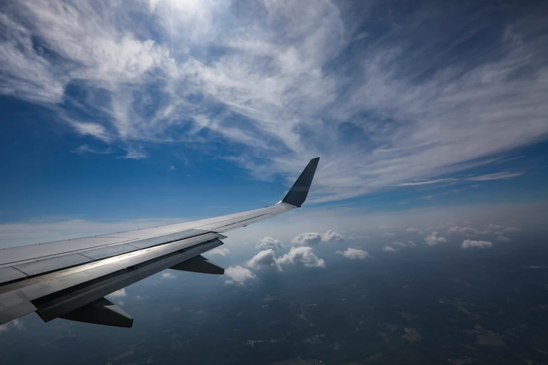 view from a plane window as it flies in the sky