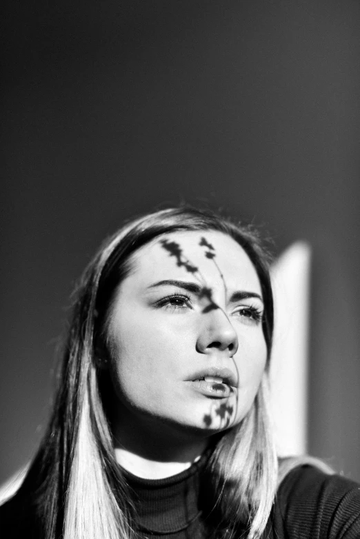 woman making face with bird's on the forehead