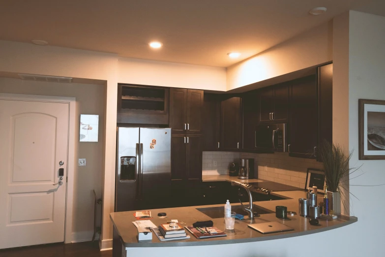 a large kitchen with a bar and two sinks