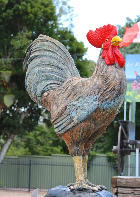 an intricately decorated statue with a rooster on top of it