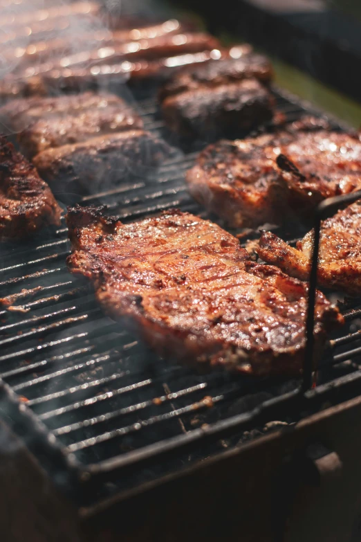 grilled hamburger patties on a charcoal grid