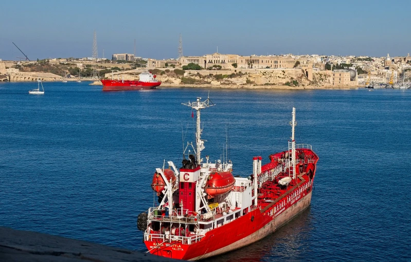 a ship is docked in a port on the water