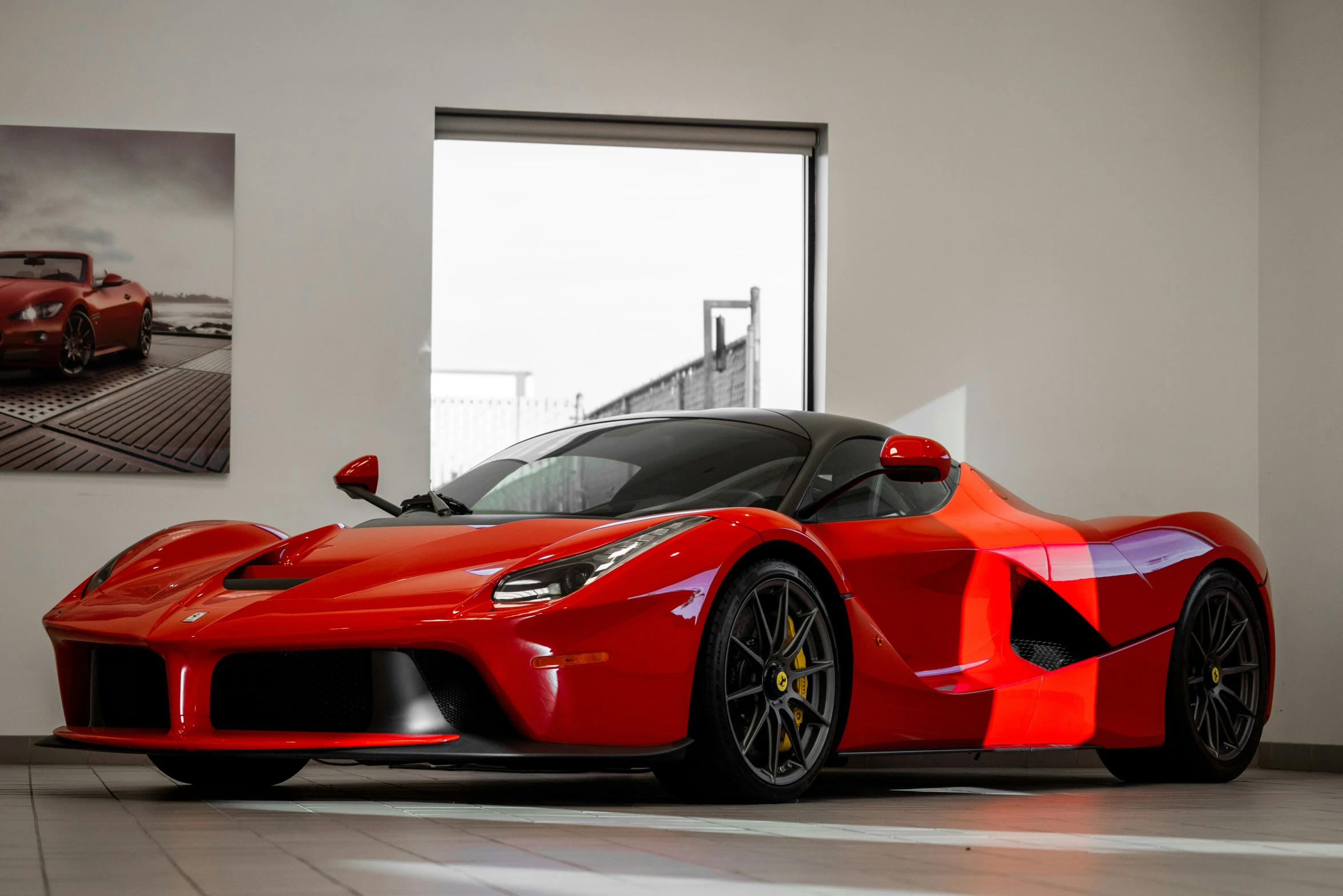 a ferrari sport car sits in the showroom